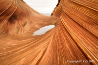 At ''The Wave''...The Wave is a sandstone rock formation located near the Arizona-Utah border, on the slopes of the Coyote Buttes, in the aria Canyon-Vermilion Cliffs Wilderness,